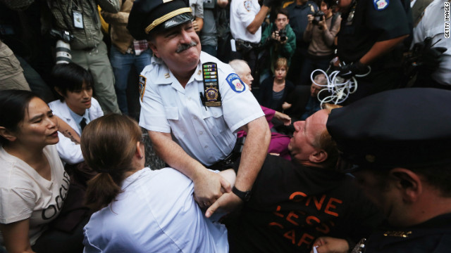 Protesters affiliated with Occupy Wall Street are arrested while attempting to form a "People's Wall" to block Wall Street on Monday.