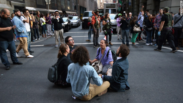 Protesters block a street near Wall Street during the one-year anniversary of the Occupy Wall Street movement on Monday.