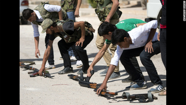 Volunteers train with rifles on the outskirts of Azaz on Wednesday. 