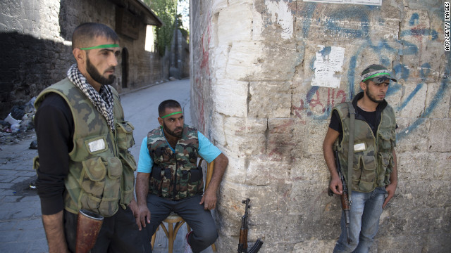 Syrian rebel fighters man a checkpoint in Aleppo on Thursday.