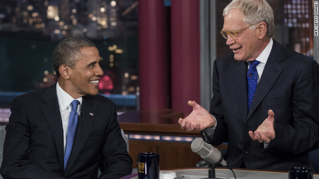 Obama and David Letterman speak during a break in the taping of the "Late Show with David Letterman" on Tuesday, September 18, at the Ed Sullivan Theater in New York.