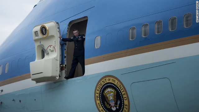 A crew member opens the door to Air Force One after the jet arrived at John F. Kennedy Airport in New York on Tuesday.