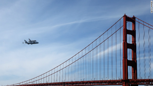 Space shuttle Endeavour passes over the Golden Gate Bridge before making its final landing in Los Angeles on Friday, September 21. The shuttle passed over California landmarks before heading to the airport. Endeavour will be placed on public display at the California Science Center. This is the final ferry flight scheduled in the Space Shuttle Program era. 