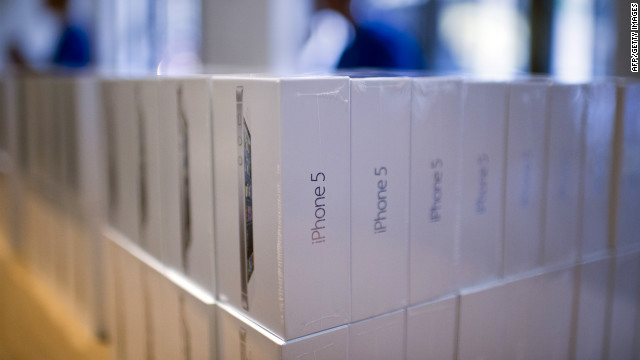 Piles of Apple's new iPhone 5 sit in boxes in an Apple store in Paris.
