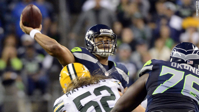 Seattle Seahawks quarterback Russell Wilson throws the winning touchdown pass against the Green Bay Packers in Seattle on Monday night. The Seahawks defeated the Packers 14-12 after a much-questioned call by the referees. 