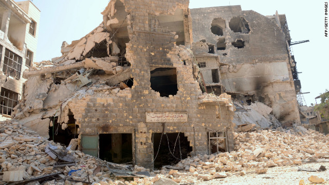 Rubble surrounds buildings destroyed by fighting between Syrian government troops and rebel forces in Aleppo on Monday.