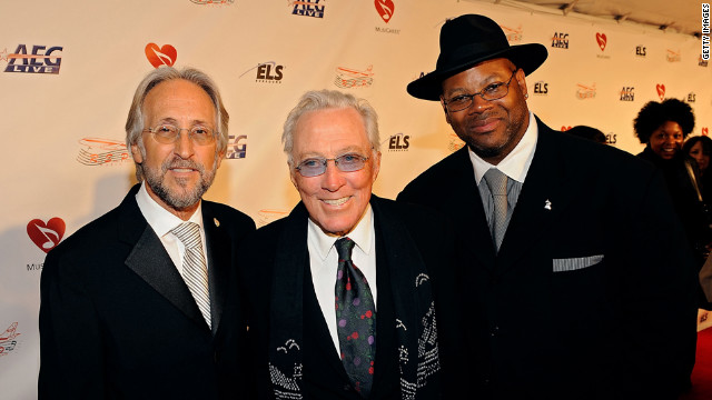 Williams with Neil Portnow, left, president of the National Academy of Recording Arts and Sciences, and producer-songwriter Jimmy Jam at the 2009 MusiCares Person of the Year tribute to Neil Diamond in Los Angeles.