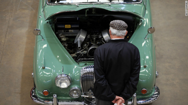 A visitor to the Footman James Bristol Classic Car Show stops to look at a Jaguar classic car on display on April 21, 2012 near Shepton Mallet, England.