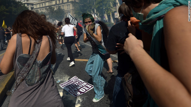 Demonstrators react to tear gas fired by police Wednesday.