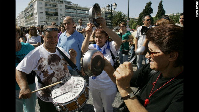 Protesters shout slogans and play makeshift instruments Wednesday.