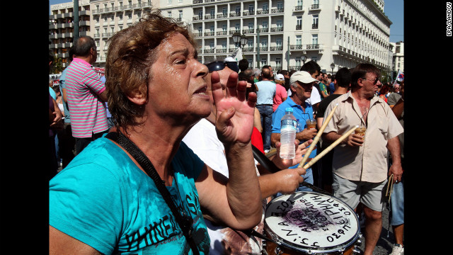 Demonstrators shout slogans Wednesday in front of the Greek parliament. <a href='http://www.cnn.com/2012/09/26/europe/gallery/spain-protest/index.html'>See anti-austerity protests in Spain</a>.