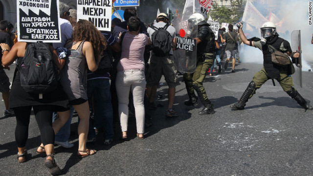 Protesters clash with riot police during the general strike demonstration in Athens on Wednesday.