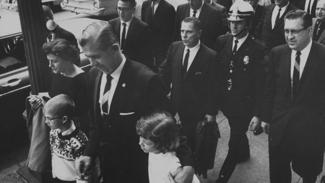 Hoffa, second row, center, leaves court after being found guilty of jury tampering in 1964.