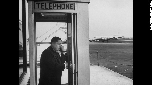 Hoffa on the phone at an airport in 1959.