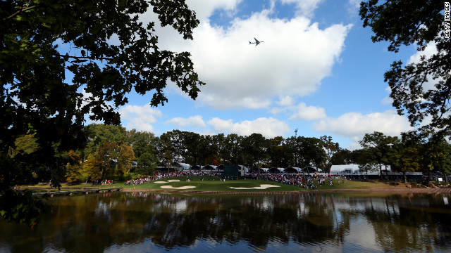 Members of the U.S. team practice Wednesday on the 13th green at Medinah, outside Chicago.