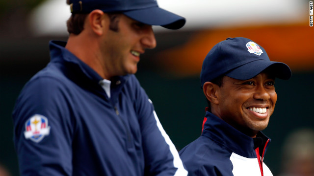 Dustin Johnson, left, and Tiger Woods of the United States laugh during a practice round Thursday.