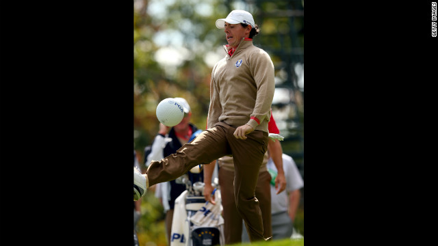 Rory McIlroy of Europe kicks a PGA ball in between play of the practice round Thursday.