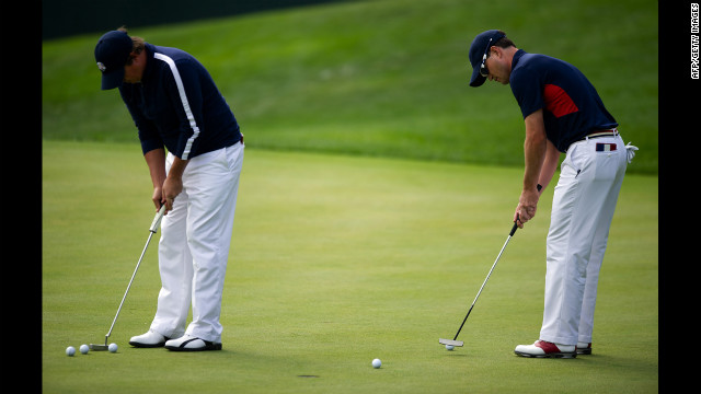 Zach Johnson, right, and Jason Dufner of the United States pratice putting on the 17th green Thursday.