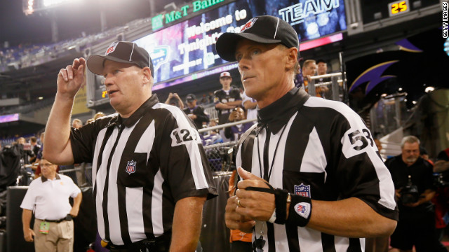 NFL officials take the field before the start of the Baltimore Ravens-Cleveland Browns game in Baltimore on Thursday.