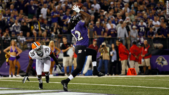 Wide receiver Torrey Smith of the Baltimore Ravens catches a touchdown pass in the second quarter against cornerback Tashaun Gipson of the Cleveland Browns Thursday.