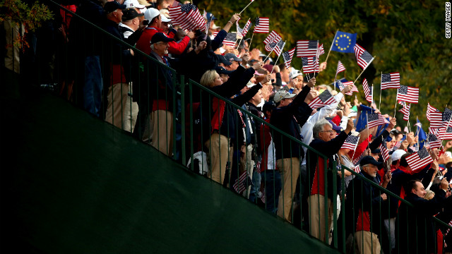 USA fans cheer the players on the first tee Friday.