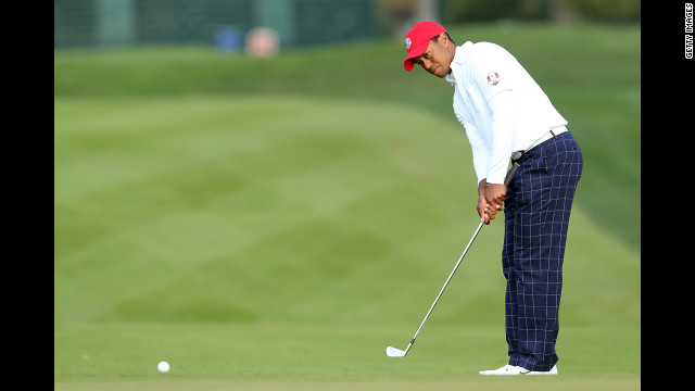 American golfer Tiger Woods chips on the first hole.