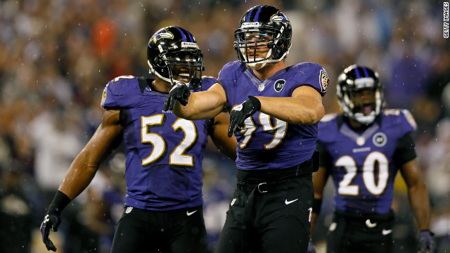 Outside linebacker Paul Kruger, center, of the Baltimore Ravens celebates after inside linebacker Ray Lewis, left, sacked Browns quarterback Brandon Weeden on Thursday.