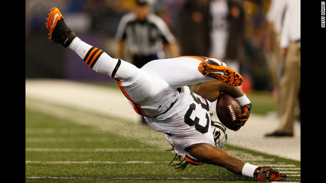 Running back Trent Richardson of the Cleveland Browns flips upside down during a run against the Baltimore Ravens Thursday.