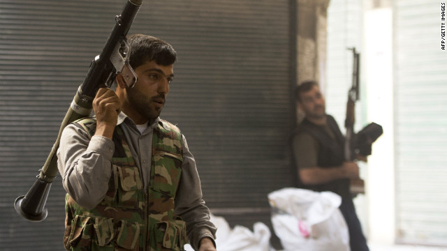 Syrian rebels take their position during fighting with government troops in Aleppo on Friday, September 28. Syrian forces clashed with opposition fighters in the nation's largest city after the launch of a "decisive battle" to push regime soldiers out, opposition activists said.
