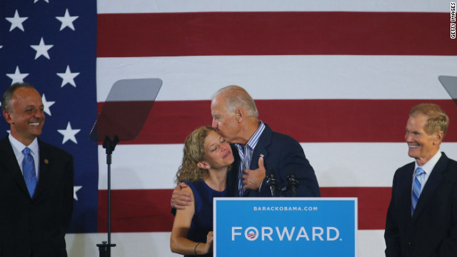 Vice President Joe Biden hugs U.S. Rep. Debbie Wasserman Schultz, chairwoman of the Democratic National Committee, as he arrives for a campaign event Friday in Boca Raton, Florida. U.S. Sen. Bill Nelson is at right.