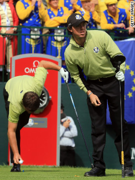 McIlroy and McDowell, both of Northern Ireland, wait on the first tee on Friday afternoon.