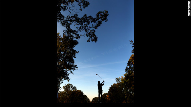 Bubba Watson of the USA watches his tee shot on the second hole.