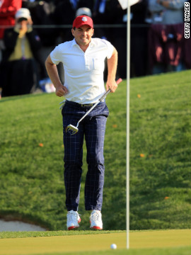 Keegan Bradley of the USA urges a putt to drop on the 15th green during the afternoon four-ball matches.