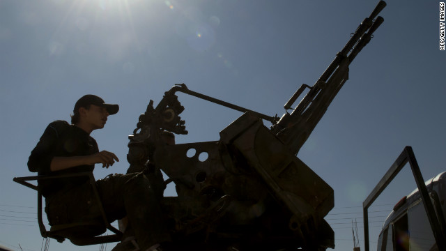 A Syrian rebel mans a machine gun near Al-Bab, northeast of Syria's second city Aleppo. 