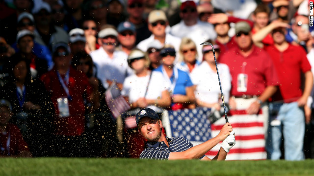 Webb Simpson of the United States plays a bunker shot on Saturday.