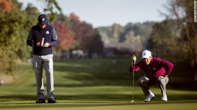 Team USA's Phil Mickelson, left, and Team Europe's Lee Westwood of England study the fifth green during a morning foursomes match on Saturday.