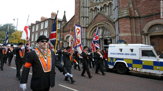 Orangemen march past St.Patrick's Catholic Church in north Belfast, Northern Ireland on September 29, 2012. 