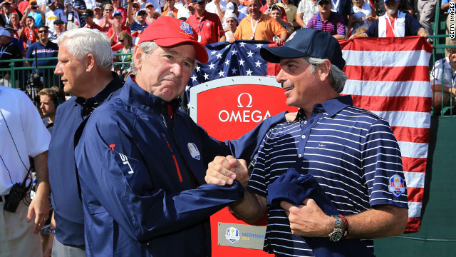 Former U.S. President George W. Bush shakes hands with Fred Couples, assistant captain of Team USA on Saturday, September 29.