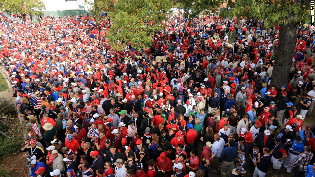 A sea of fans crowds around the first tee near the clubhouse Sunday.