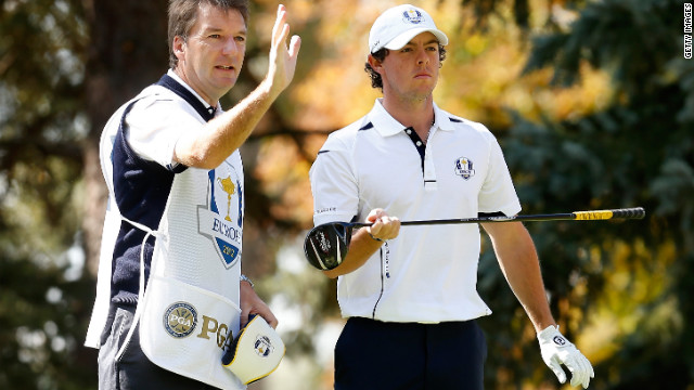 Rory McIlroy of Europe lines up a shot with his caddie J.P. Fitzgerald on the third tee on Sunday.