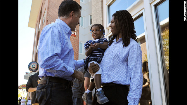 Romney greets a father and his daughter after having lunch Tuesday at a restaurant in Denver.