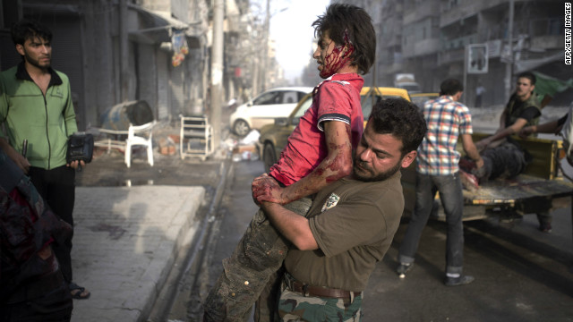 A fighter injured in the Arqub neighborhood of northern city of Aleppo is brought to a hospital on October 1, 2012, as fighting in Syria's second largest city between rebel forces and government troops continues. 