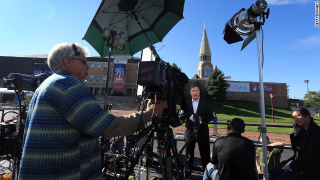 Television crews begin to broadcast on Tuesday outside the Ritchie Center, where the first 2012 presidential debate will take place.