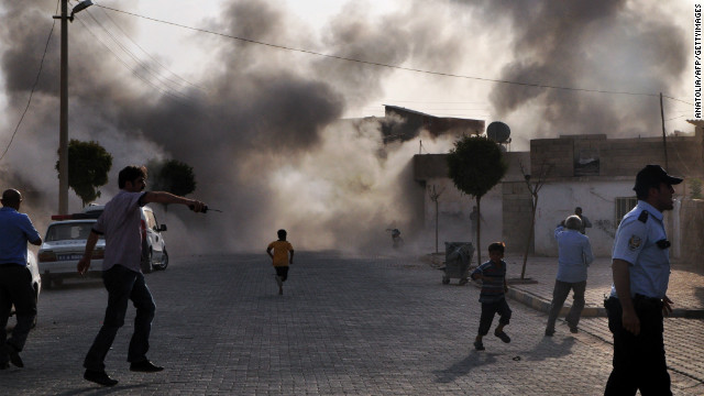 Smoke rises from the explosion area after several Syrian shells crashed inside the town of Akcakale in Turkey, killing at least five people on Wednesday, October 3. It wasn't the first deadly cross-border incident between the two neighbors during the 18-month-long uprising in Syria.