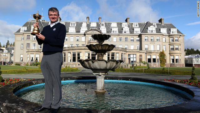 Paul Lawrie poses with the Ryder Cup in front of the Gleneagles Hotel in Scotland. 