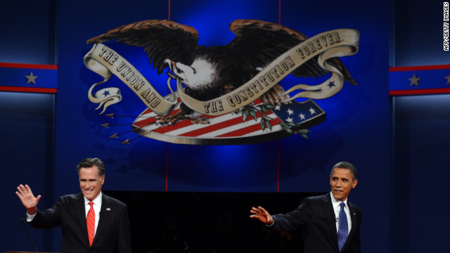 Romney and Obama wave to the crowd at the start of the presidential debate.