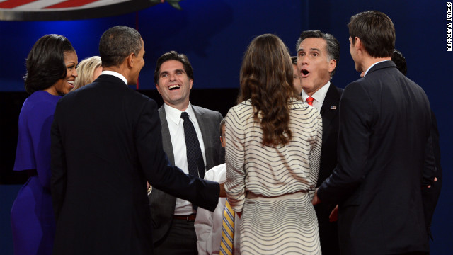 Michelle and Barack Obama, left, join Mitt Romney and his family at the conclusion of the first presidential debate.