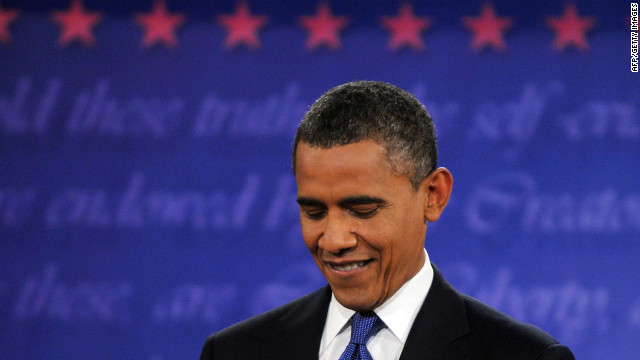 Obama listens during the debate in Denver.