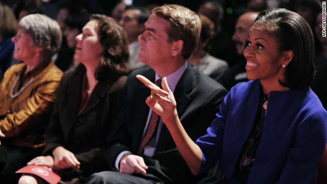 Michelle Obama points to Lehrer before the start of the debate.
