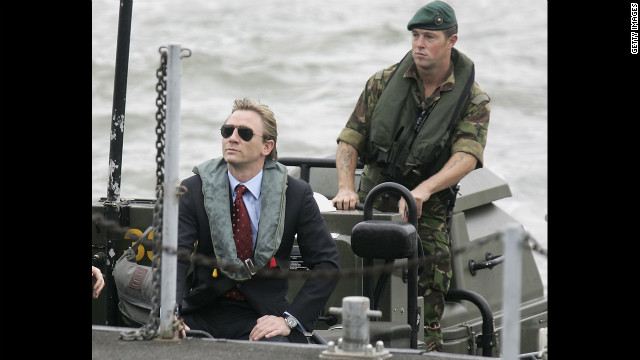 Daniel Craig greets a naval officer as he is unveiled as the new James Bond in October 2005.